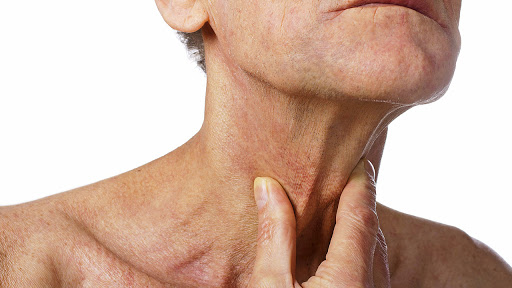 senior man with throat or neck irritation